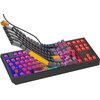 Klawiatura mechaniczna z podświetleniem RGB, z klawiszami w kolorze szarym i żółtym, uniesionymi nad podstawą, ukazującymi czerwone przełączniki. Na obudowie widoczne jest logo "Genesis".