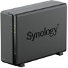Czarny serwer plików z widocznym logo "Synology" na obudowie oraz trzema zielonymi diodami oznaczonymi jako "STATUS", "LAN" i "DISK". Na dolnej części obudowy znajduje się oznaczenie "DS124".