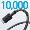 Czarny kabel USB-C z plecionym oplotem, z widocznym napisem "ANKER" na wtyczce, na tle liczby "10,000" w niebieskim kolorze.