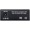 Czarny panel urządzenia z gniazdem zasilania oznaczonym "DC 5V" oraz tekstem: "This device complies with Part 15 of the FCC rules." Widoczne są także symbole certyfikacji FCC i CE.