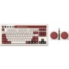 Na zdjęciu znajduje się klawiatura w stylu retro z czerwono-białymi klawiszami, oznaczona jako "8BitDo Retro Keyboard", oraz dodatkowe urządzenie z dwoma dużymi czerwonymi przyciskami i logo "8BitDo".