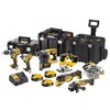 Na zdjęciu znajduje się zestaw elektronarzędzi marki DEWALT, w skład którego wchodzą różne narzędzia akumulatorowe w kolorach żółtym i czarnym, trzy walizki transportowe oraz ładowarka i akumulatory. Widoczne są logotypy DEWALT na każdym z narzędzi oraz w