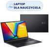 Na zdjęciu widoczny jest laptop z kolorowym ekranem, na którym wyświetlony jest napis "ASUS Vivobook", oraz jego zamknięta pokrywa z logo "ASUS Vivobook". Nad laptopem znajduje się napis "LAPTOP DLA NAUCZYCIELA" obok ikony laptopa.