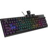 Czarna klawiatura mechaniczna z podświetleniem RGB, na której widoczne są klawisze z literami i symbolami, a niektóre klawisze są uniesione, ukazując brązowe przełączniki. Na obudowie klawiatury znajduje się logo "GENESIS".