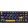 Czarna klawiatura mechaniczna z podświetleniem RGB, posiadająca klawisze w różnych kolorach, w tym żółte klawisze Escape, spacji i Enter. Na obudowie widoczne jest logo "GENESIS".