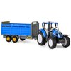 Na zdjęciu znajduje się niebieski traktor zabawkowy z przyczepą do transportu inwentarza, z czarnymi i żółtymi elementami. Na przyczepie widoczny jest napis "New Holland T5" oraz oznaczenia ostrzegawcze.