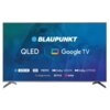 Telewizor z logo "BLAUPUNKT" na ekranie, z napisami "QLED" i "Google TV". Widoczne są również oznaczenia technologii: "4K ULTRA HD", "HDR", "MEMC", "Dolby VISION", "Dolby ATMOS", oraz logotypy "Google Assistant", "NETFLIX" i "YouTube".