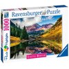 Pudełko puzzli Ravensburger zawiera obraz górskiego krajobrazu z odbiciem w jeziorze, z napisem "Beautiful Mountains" oraz informacją o 1000 elementach. Na opakowaniu widnieje logo Ravensburger i oznaczenie "Premium Puzzle Softclick Technology".