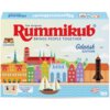 Pudełko gry logicznej "Rummikub Classic Gdańsk Edition" z kolorową grafiką przedstawiającą panoramę Gdańska, z napisem "The Original Rummikub Brings People Together" oraz "Gdańsk Edition". Widoczne są również dwa symbole płytek i informacja: "Zawiera 2 do