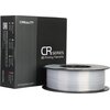 Czarne pudełko z białym napisem "CREALITY CR Series 3D Printing Filaments" stoi obok szpuli srebrnego filamentu. Na boku pudełka widnieje tekst: "SHENZHEN CREALITY 3D TECHNOLOGY CO., LTD." oraz "MADE IN CHINA".