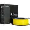 Na zdjęciu znajduje się czarna pudełko z napisem "CREALITY CR series 3D Printing Filaments" oraz żółta szpula filamentu. Na pudełku widoczne są także informacje o kolorach i producent, "SHENZHEN CREALITY 3D TECHNOLOGY CO., LTD.", oraz napis "MADE IN CHINA