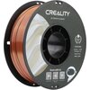 Zdjęcie przedstawia szpulę filamentu do drukarki 3D w kolorze miedzianym, z widocznym logo "CREALITY" oraz napisem "3D PRINTER FILAMENT". Na etykiecie znajdują się informacje: "CR-PLA SILK", "Diameter: 1.75MM", "Net Weight: 1KG", "Extruder Temp: 190°C-230