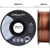 Na zdjęciu widoczna jest szpula filamentu do drukarki 3D w kolorze miedzianym, z napisem "CREALITY 3D PRINTER FILAMENT" oraz "CR-PLA SILK". Dodatkowo podano specyfikacje: "Diameter: 1.75MM", "Net Weight: 1KG", "Extruder Temp: 190°C-230°C", a także umieszc