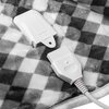 Na zdjęciu widoczny jest fragment koca w kratkę z dwoma białymi złączami elektrycznymi. Na jednym z nich znajduje się napis "ENCL022".