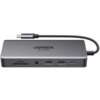 Szary hub UGREEN z napisem "UGREEN 8K 30Hz" posiada różne porty, w tym dwa porty USB oznaczone jako "10Gbps", port USB Typu C, gniazdo na kartę SD/TF oraz gniazdo audio. Kabel USB Typu C jest przymocowany do urządzenia, a na jego końcówce widnieje logo UG