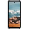Smartfon z wyświetlaczem prezentującym krajobraz górski z ośnieżonymi szczytami i piaszczystymi wydmami na pierwszym planie. Urządzenie ma czarną obudowę z widocznymi wzmocnieniami na rogach.
