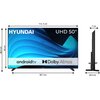 Na zdjęciu widoczny jest telewizor z napisem "HYUNDAI" oraz "UHD 50"", z ekranem wyświetlającym niebieskie fale i logo "android tv" oraz "Dolby Atmos". Obok telewizora znajdują się wymiary: szerokość 112,5 cm, wysokość 68,5 cm, głębokość 7 cm, a szerokość