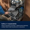 Na zdjęciu widoczna jest otwarta zmywarka z umieszczonymi w niej elementami frytkownicy beztłuszczowej oraz innymi naczyniami. Na dole zdjęcia znajduje się tekst: "Łatwy w czyszczeniu. Nieprzywierającą powłokę i zdejmowane elementy możesz łatwo umyć ręczn