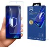 Na zdjęciu widoczny jest telefon z nałożonym szkłem ochronnym, trzymany w dłoni, z wyświetlaczem przedstawiającym niebieskie wzory i biały symbol tarczy. Obok telefonu znajduje się opakowanie produktu z napisem "3mk FlexibleGlass Pro™ Feel the power" oraz grafiką przedstawiającą telefon z nałożonym szkłem.