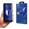 Na zdjęciu widoczny jest telefon z nałożonym szkłem ochronnym oraz opakowanie produktu. Na opakowaniu znajduje się logo "3mk" oraz napis "FlexibleGlass Pro™ Feel the power", a także ikony certyfikatów i nagród.