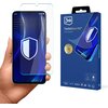 Na zdjęciu widoczny jest telefon trzymany w dłoni, na którym znajduje się przezroczyste szkło ochronne z wyświetlonym na ekranie niebieskim wzorem i białą tarczą. Obok telefonu znajduje się opakowanie produktu z napisem "3mk FlexibleGlass Pro™ Feel the power" oraz grafiką przedstawiającą szkło ochronne na telefonie.
