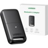 Czarny adapter z napisem "UGREEN" jest przedstawiony obok białego pudełka z tekstem "UGREEN Bluetooth 5.3 Adapter". Na pudełku znajdują się ikony z opisami: "Mutual data transfer", "Bluetooth 5.3", "Transmission distance at 20m".