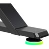 Fragment biurka gamingowego w kolorze czarnym z widocznym elementem konstrukcyjnym oraz okrągłą podstawą z podświetleniem RGB w kolorze zielonym.