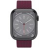 Na zdjęciu widoczny jest smartwatch z fioletowym paskiem o plecionej strukturze. Tarcza zegarka jest szara z białymi wskazówkami i cyframi, a na obwodzie znajdują się dodatkowe oznaczenia, takie jak "UV", "21°", "375", "19" oraz "04".