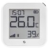Biały czujnik temperatury i wilgotności z wyświetlaczem pokazującym godzinę 15:07, temperaturę 26,0°C oraz wilgotność 39%. Na ekranie widoczne są także ikony sygnału, Bluetooth i poziomu baterii, a na obudowie znajduje się logo producenta.
