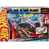 Opakowanie zestawu "Tor Hot Wheels Formuła 1 JDY15" przedstawia tor wyścigowy z samochodami, z widocznymi napisami: "Hot Wheels", "Formula 1", "Racing", "Sprint Race Circuit", oraz "New Nouveau 2025". Na górze opakowania znajdują się trzy modele samochodó