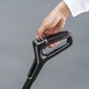 Na zdjęciu widoczny jest uchwyt mopa elektrycznego z przyciskami oznaczonymi jako "Auto" i "Eco". Na uchwycie znajduje się również logo z literą "T".