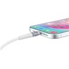 Na zdjęciu widać biały kabel USB Typ-C - Lightning podłączony do smartfona z kolorowym ekranem, na którym widoczne są ikony aplikacji. Kabel ma przezroczystą końcówkę, a obok portu widać otwory głośnika.