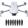 Na zdjęciu widoczny jest biały dron z rozłożonymi ramionami i kamerą z przodu, z napisem "Potensic" na górnej części obudowy. Poniżej drona znajduje się osiem czarnych śmigieł ułożonych w dwóch rzędach.