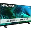 Telewizor z logo "HYUNDAI" na górze ekranu, z napisem "32” androidtv FULL HD" na tle abstrakcyjnych, zielono-niebieskich wzorów. Na dolnej ramce widoczne jest również logo "HYUNDAI".