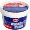 Plastikowe opakowanie z białą pokrywką zawiera produkt "Pasta do mycia rąk ORO 500 ml", z widocznymi napisami: "testowana dermatologicznie bez piasku ściernego" oraz "Handwasch Paste sandfrei". Na etykiecie znajduje się również logo "ORO" i informacje o p