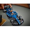 Na zdjęciu znajduje się model bolidu F1 w kolorze niebieskim z elementami czarnymi i pomarańczowymi, z widocznymi detalami konstrukcji. Na bolidzie widoczne są napisy: "MYPROTEIN" oraz "W".