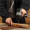 Na zdjęciu znajduje się dolna część zakrętarki udarowej z widocznym uchwytem i podstawą. Na podstawie widoczne są napisy: "BRUSHLESS 20V MAX" oraz logo "DEKO".