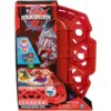 Czerwone opakowanie z grafiką przedstawiającą arenę do gry Bakugan oraz postać smoka. Widoczny tekst: "BAKUGAN BRAWL ZONE", "SPECIAL ATTACK DRAGONOID", "WARNING: CHOKING HAZARD", oraz logo producenta Spin Master.