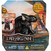 Opakowanie zawiera czarną figurkę smoka z zielonymi oczami, a na nim widnieje napis "HOW TO TRAIN YOUR DRAGON" oraz "ROARING MINIS TOOTHLESS". Na opakowaniu znajdują się również informacje: "25+ SOUNDS", "TRY ME!", "WARNING: CHOKING HAZARD - Small parts. 