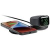 Na zdjęciu znajduje się czarna ładowarka indukcyjna z dwoma miejscami do ładowania, na której umieszczono smartwatch z zieloną ikoną ładowania oraz smartfon z kolorowym ekranem, na którym widnieje napis "25% Charged" i zielona ikona ładowania. Produkt jes
