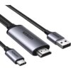 Na zdjęciu widoczny jest kabel z trzema różnymi złączami: HDMI, USB Typ-C i USB, z plecionym przewodem. Na obudowie kabla znajduje się napis "UGREEN".