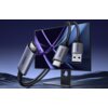 Na zdjęciu widoczny jest monitor z dynamiczną grafiką na ekranie oraz kabel z trzema różnymi końcówkami: HDMI, USB Typ-C i USB, z napisem "UGREEN" na każdej z nich. Kabel jest przedstawiony w sposób sugerujący jego elastyczność i funkcjonalność.