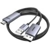 Na zdjęciu znajduje się pleciony kabel z trzema złączami: HDMI, USB i DisplayPort. Na złączach widoczne są napisy "HDMI" oraz "UGREEN".