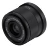 Czarny obiektyw z widocznymi napisami: "AF 25mm 1:1.7 STM ASPH ED IF", "Φ52mm 0.3m/1ft", oraz "IMAGE SIZE ⌀28.4mm". Obiektyw ma ryflowaną powierzchnię i gładki pierścień.