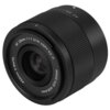 Czarny obiektyw z widocznymi napisami: "AF 25mm 1:1.7 STM ASPH ED IF", "IMAGE SIZE ⌀28.4mm", "⌀52mm 0.3m/1ft". Obiektyw ma ryflowaną powierzchnię i gładki pierścień z oznaczeniami.