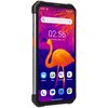 Smartfon z pomarańczową obudową wyświetla ekran główny z aplikacjami: Weather, Meet, Assistant, Play Store, a w tle widoczny jest obraz termowizyjny flaminga. Na ekranie widnieje godzina 02:56 oraz data Tuesday, May 16.