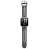 Szary smartwatch z prostokątnym wyświetlaczem i perforowanym paskiem. Na ekranie widoczne są duże cyfry "10:09" oraz informacje: "Distance 16.07", "Steps 12,003", "Readiness 92", "Stand 03 Reps", "47", "1027", "7.2h", "55".