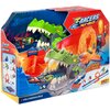 Pudełko z zabawką "T-Racers Mix’n Race Volcano Saurus" przedstawia kolorową wyrzutnię w kształcie zielonego dinozaura z otwartą paszczą, w której znajduje się mały samochodzik. Na opakowaniu widnieją napisy: "T-Racers Mix’n Race", "Customize Your Track", 