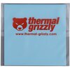Na zdjęciu widoczny jest niebieski termopad z czerwonym logo i napisem "thermal grizzly" oraz adresem strony internetowej "www.thermal-grizzly.com". Produkt jest zapakowany w przezroczystą folię ochronną.