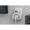 Na zdjęciu widoczne jest białe gniazdo elektryczne TESSAN TS-327 podłączone do ściany, z kilkoma wtyczkami i portami USB. Na gniazdzie znajduje się logo "TESSAN".